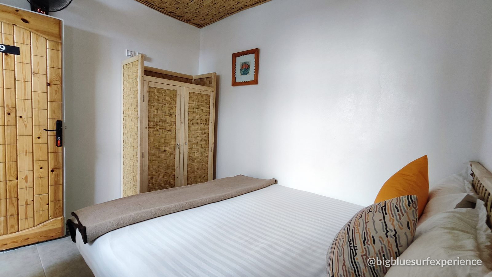 Double room at BigBlue Surf Hostel with wardrobe and keypad door lock