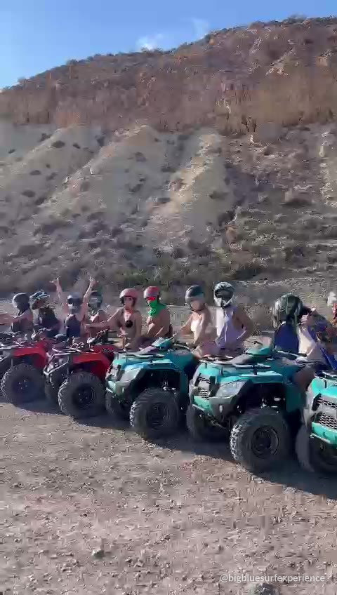 Group riding quad bikes through the coastal hills north of Taghazout